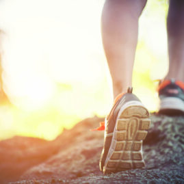 Young Runner Woman Legs Close Up During Running Across The Rock,